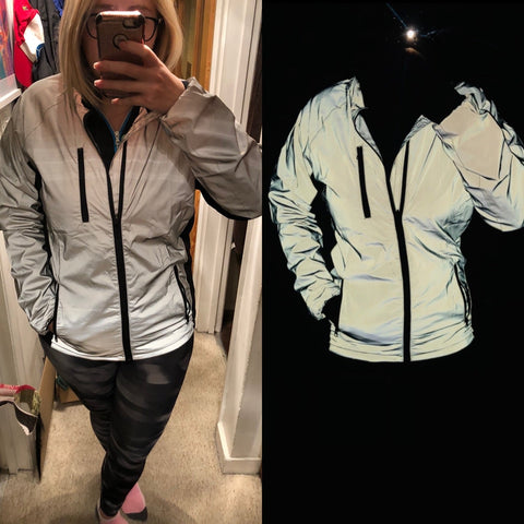 BTR silver reflective cycling and running jacket glowing under reflection