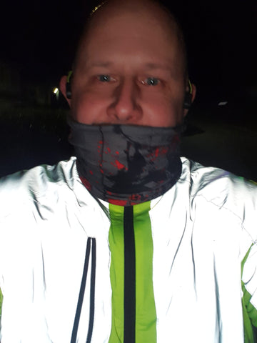 BTR sports jacket shown with reflective visible and showing the bright reflect